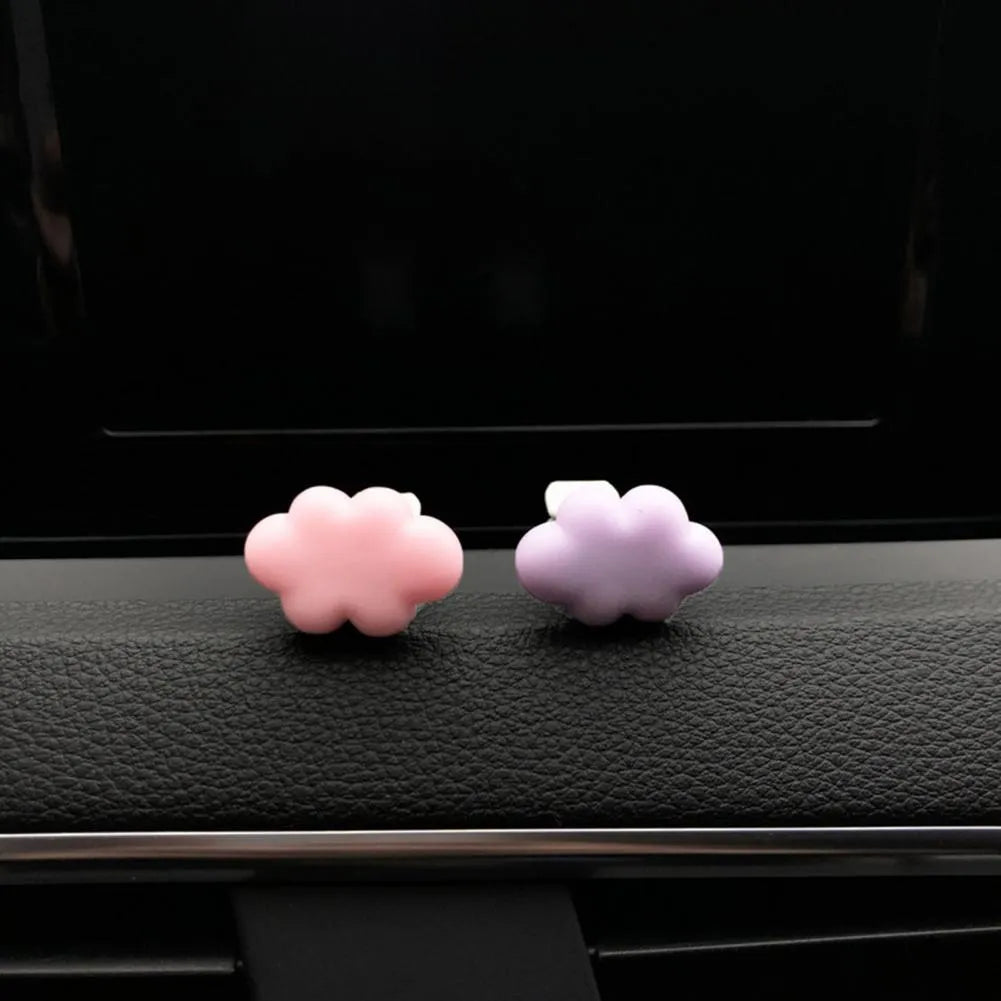 Resin car air vent fragrance clip in cartoon design, 17mm by 27mm, shown in one of six colours.