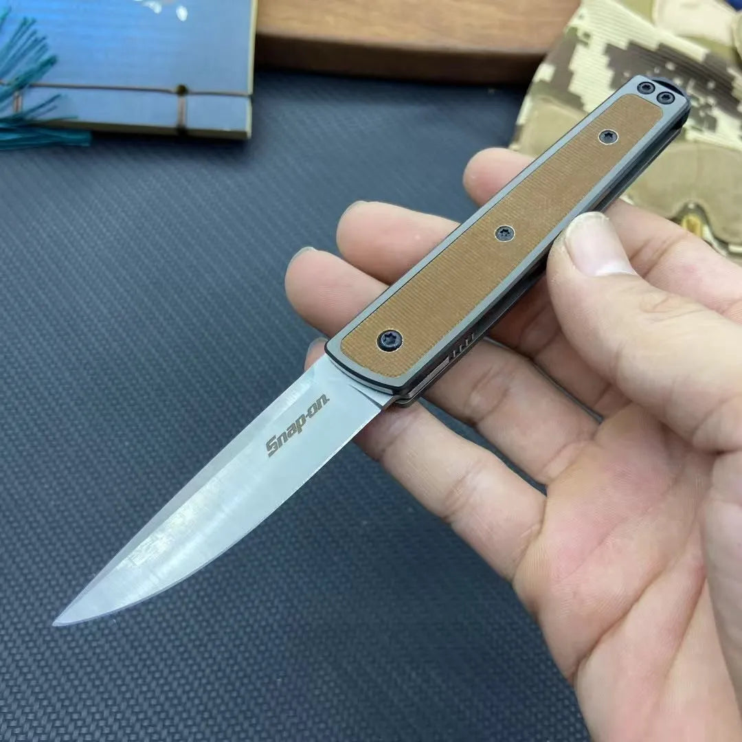 Folding fruit knife with stainless steel blade in black, brown, or red handle colours