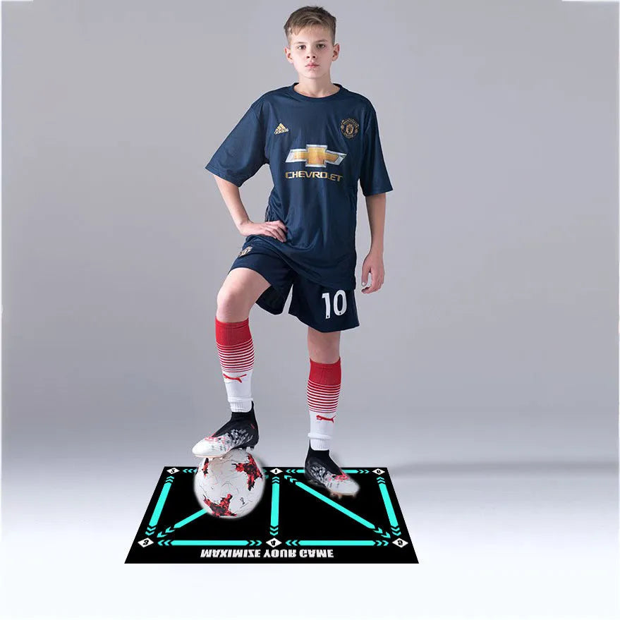 Black rectangular football training mat measuring 60 by 90 centimetres on a flat surface.