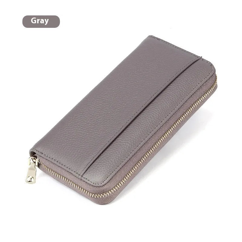 Women's long genuine leather wallet in multiple colours showing zip-around closure and anti-theft card slots.