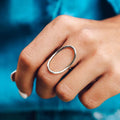 Classic minimalist copper ring with zircon inlay in rose gold colour on white background