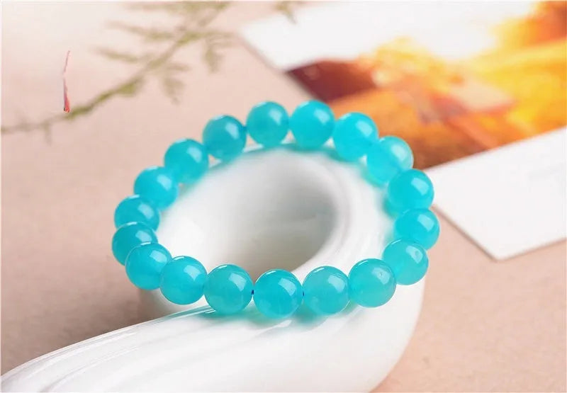 Natural amazonite scattered beads in ice colour with polished surfaces, showing single circle and three ring styles