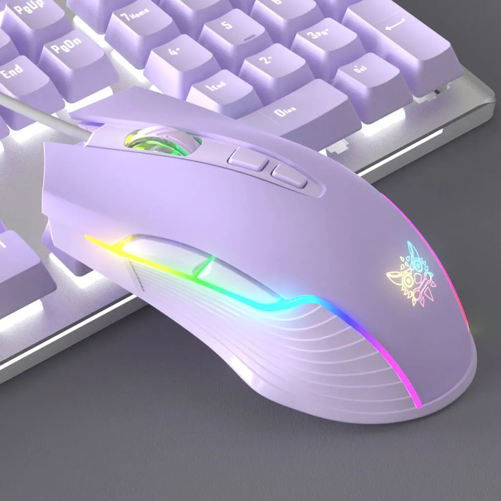 Purple and white mechanical keyboard and wired mouse set with backlit keys on a desk.