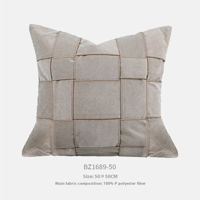 Square chenille woven cushion in beige colour on a grey sofa, 50x50cm size.