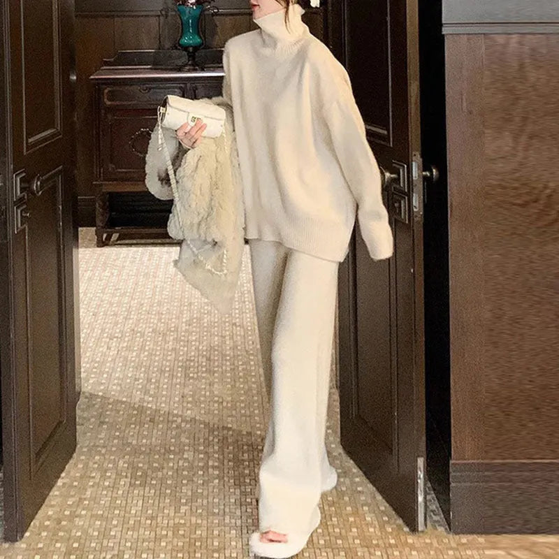 Women's beige acrylic long-sleeve sweater and wide-leg trousers two-piece casual set.