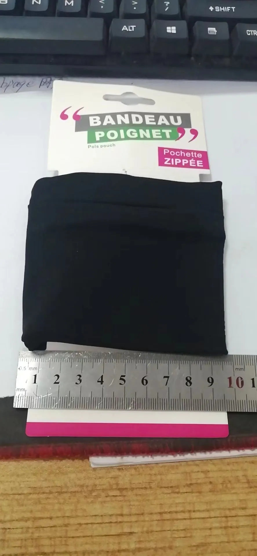 Wrist bag armband sleeve for mobile phone measuring 10 by 10.5 centimetres.