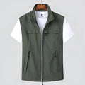 Man wearing a khaki waterproof hooded vest with multiple patch pockets, cardigan style