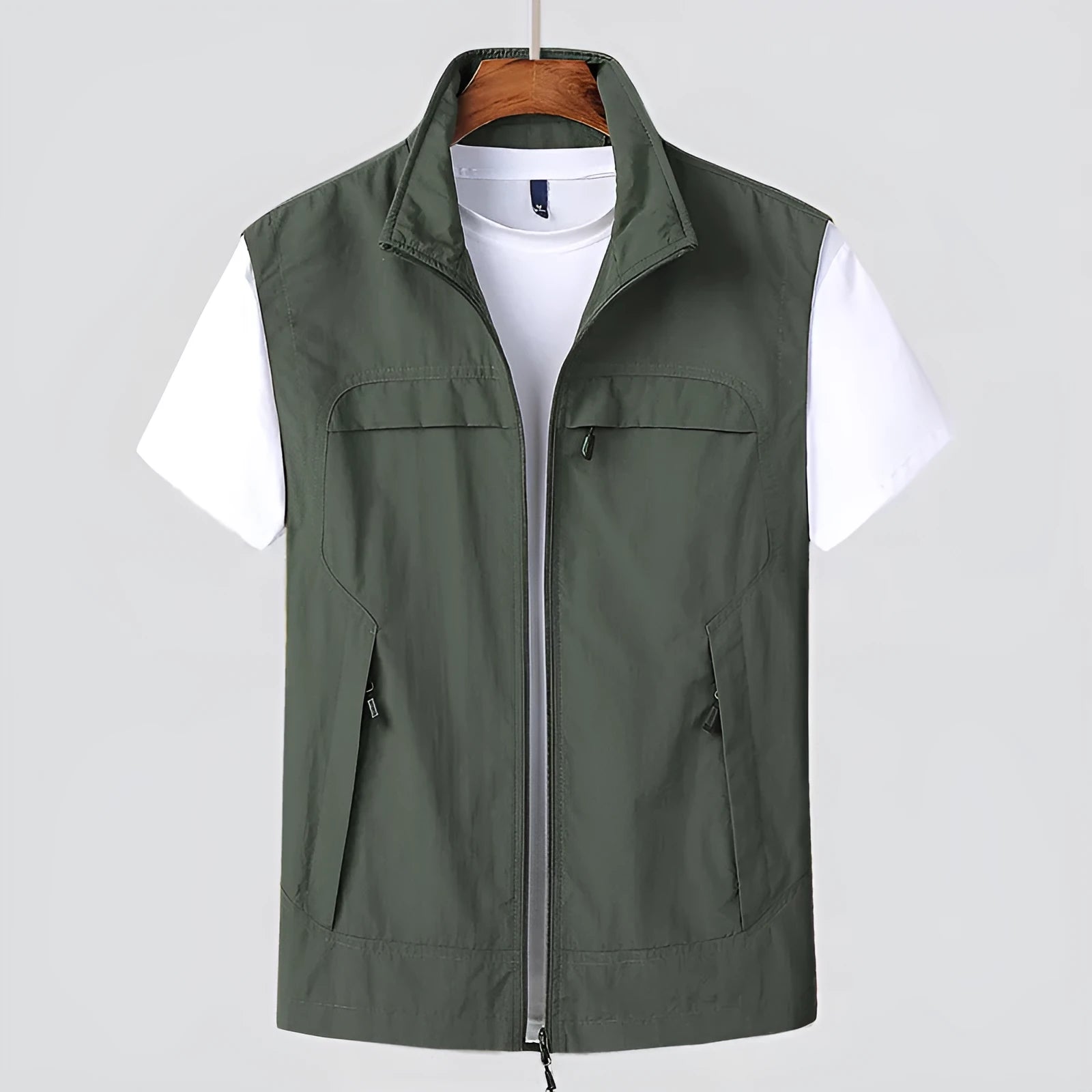 Man wearing a khaki waterproof hooded vest with multiple patch pockets, cardigan style