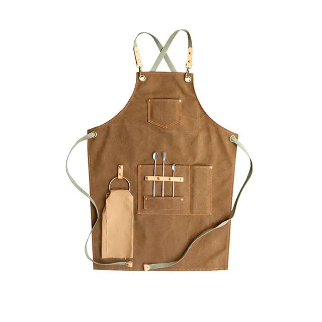 Canvas cross strap apron in camel colour shown from the front.