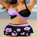 Purple women's lace-up bikini swimsuit set with a matching high-waisted skirt.