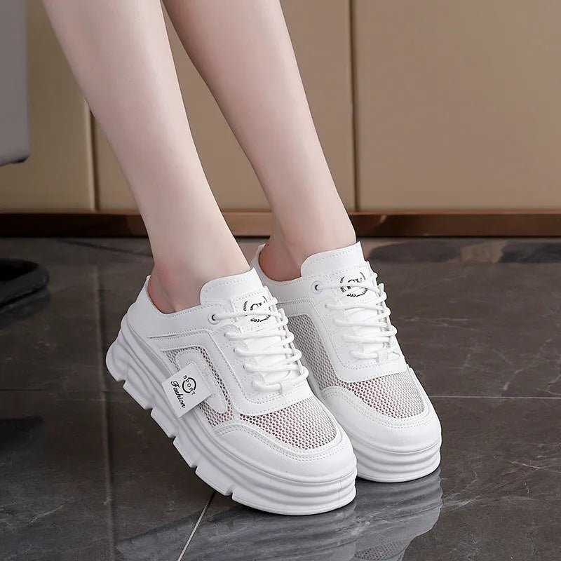 Women's black mesh half slipper with round toe and rubber sole on a white background.