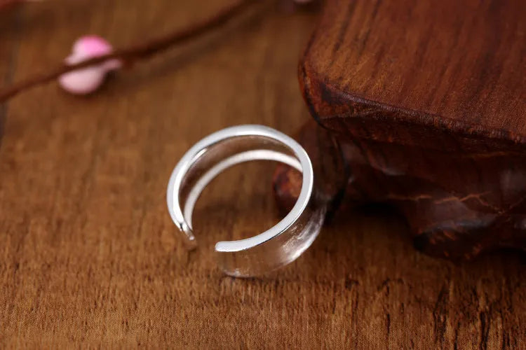 Geometric sterling silver ring with adjustable opening and frosted electroplated finish