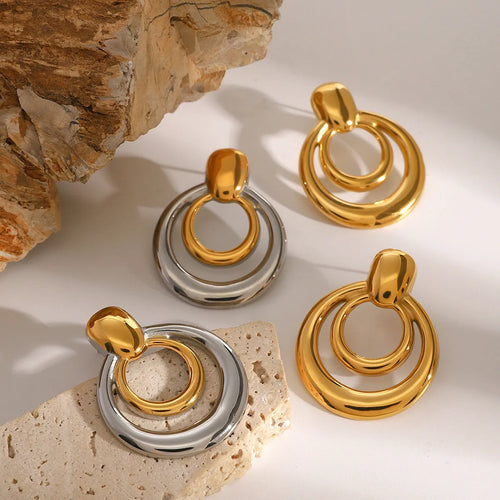 Golden round stud earrings with double-layer hollow geometric design on titanium steel