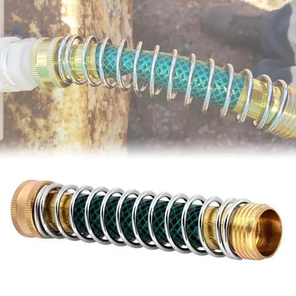 Close-up of a 15cm long brass garden hose spring connector with a visible internal spiral to prevent kinking.