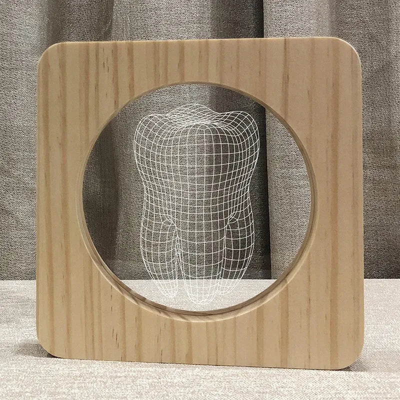 Wood colour tooth-shaped acrylic night light with USB cable on a table