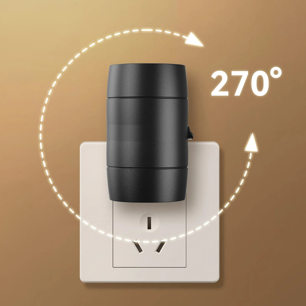A compact white plug-in night lamp with a rotatable head, shown plugged into a wall socket.
