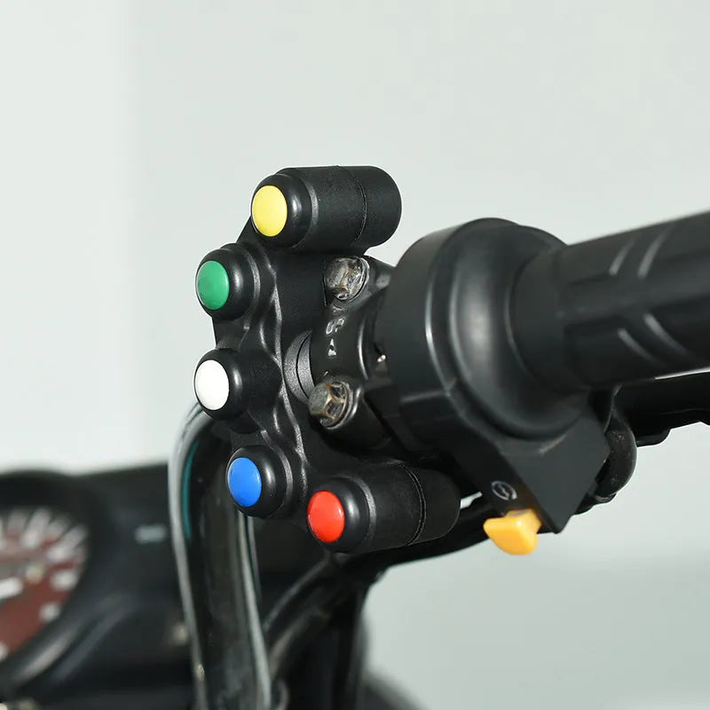 Five-position vehicle switch with red, yellow, blue, green, and white buttons for motorcycle electrical control