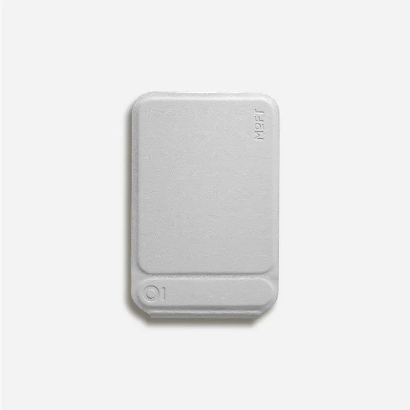 Magnetic mobile phone holder and case in leather with built-in stand, shown in grey.