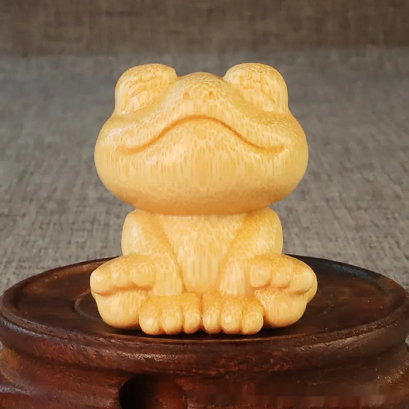 Smiling frog solid bamboo carving ornament measuring 5cm high with cartoon cute style