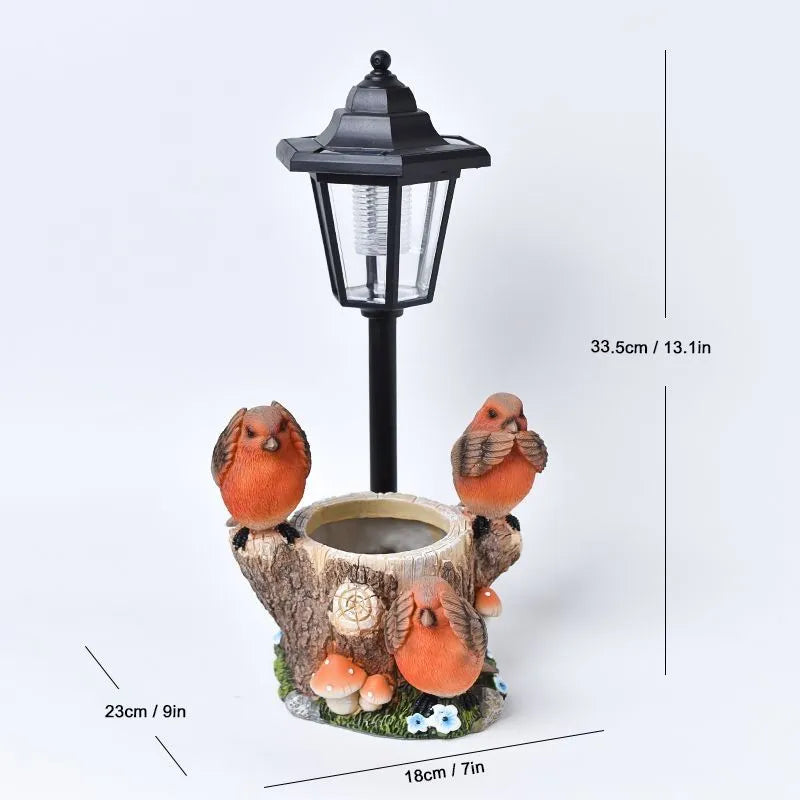 Solar hexagonal garden lamp with decorative resin figurine on plastic base for outdoor pathway lighting