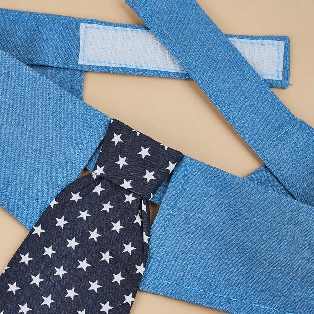 Blue denim dog collar styled as a necktie with white star pattern, showing fastener tape adjustment.