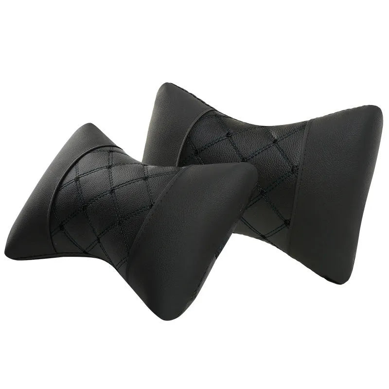 Black leather quilted car headrest pillow for neck support with diamond pattern stitching.