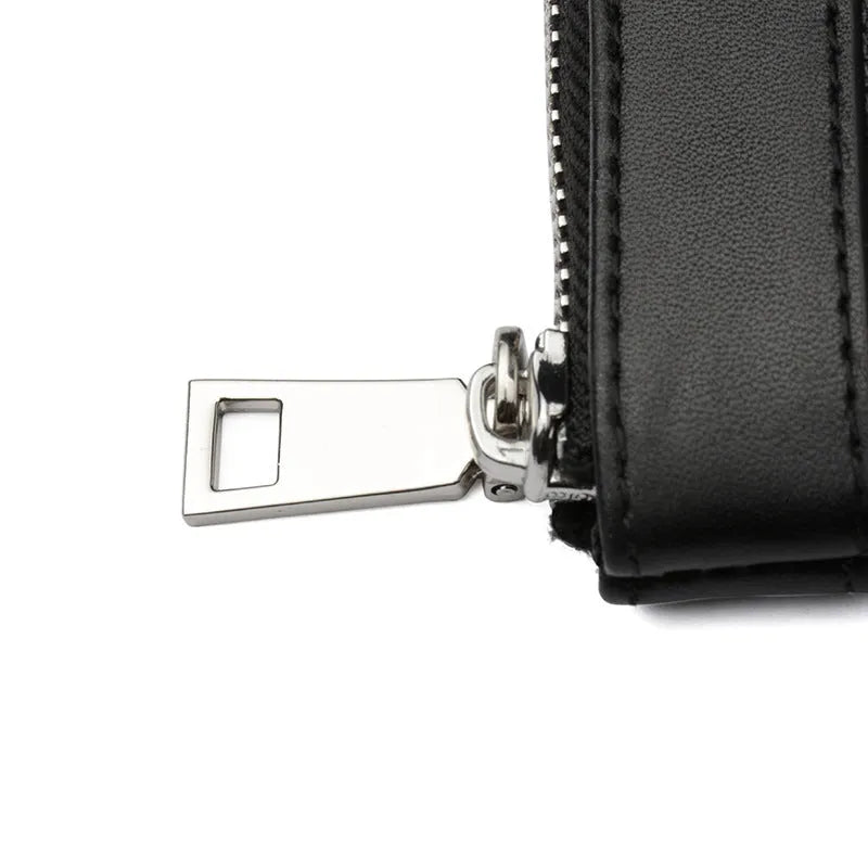 Black men's cowhide leather clutch wallet showing front view.