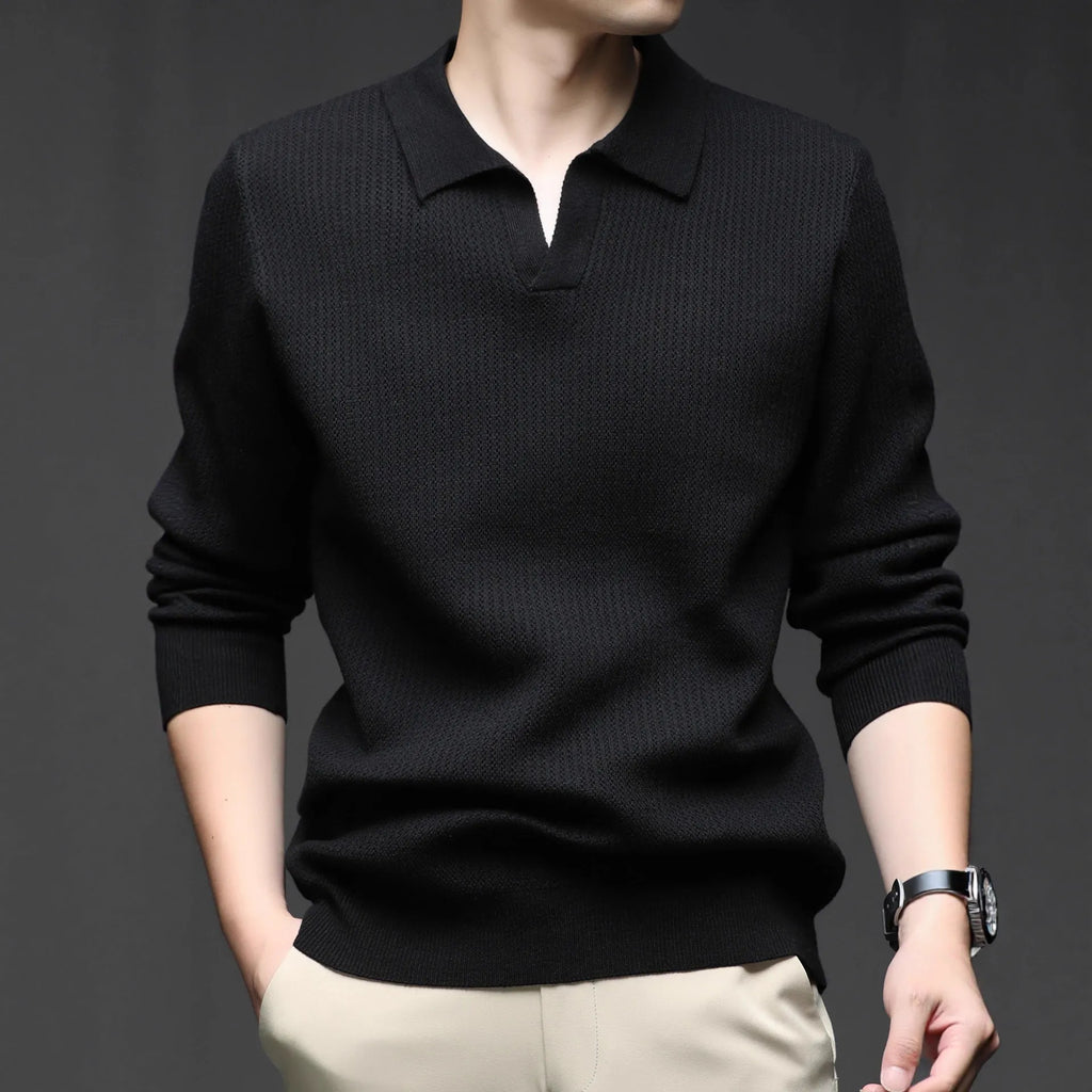 A man's loose-fitting casual pullover jumper in a neutral colour, shown on a model.