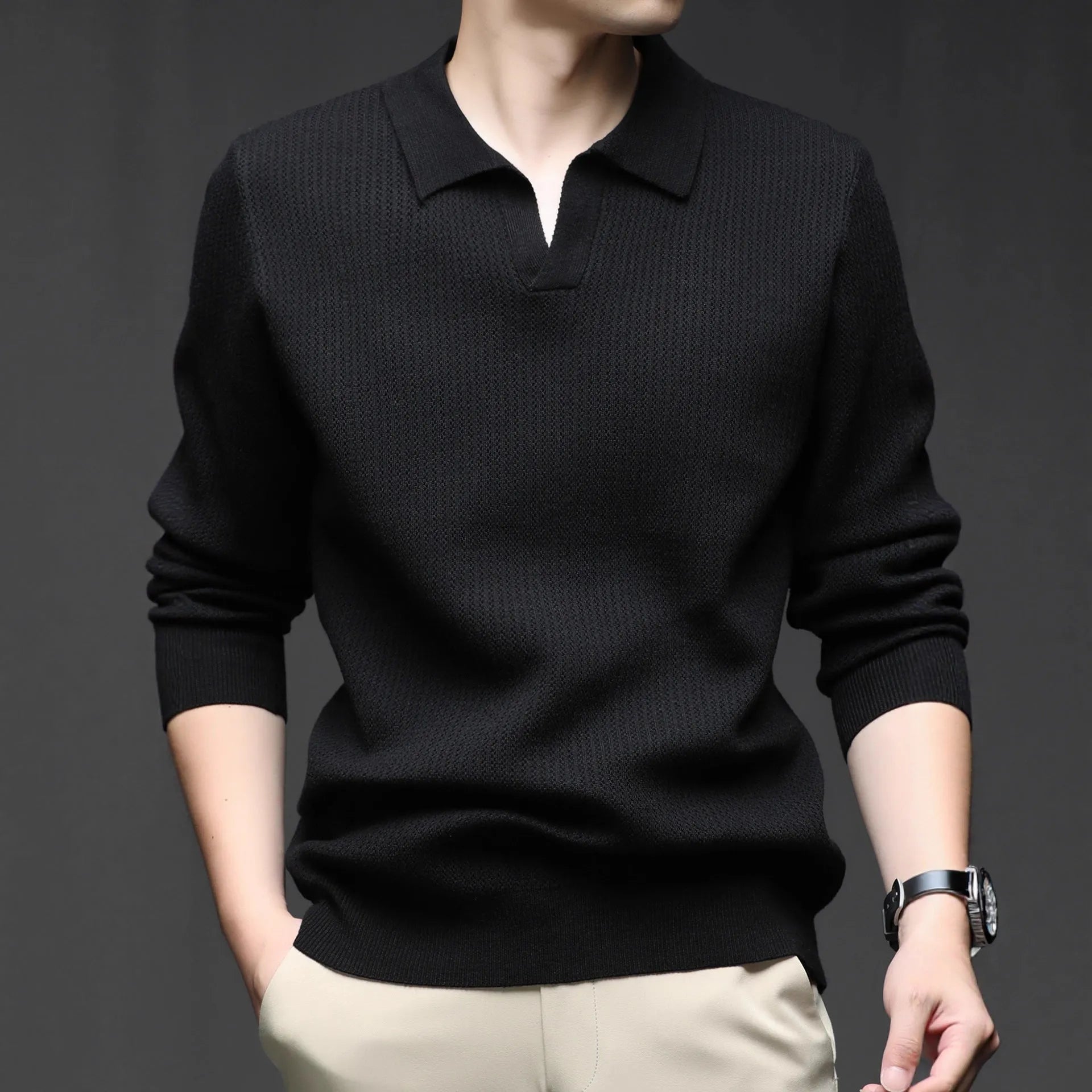 A man's loose-fitting casual pullover jumper in a neutral colour, shown on a model.