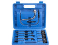 Automatic transmission oil refuelling tool kit with injector and connectors on a workshop bench