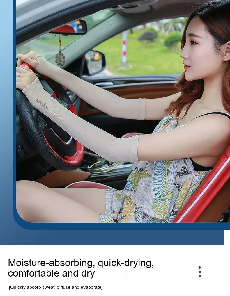 A person wearing a grey sun protection driving sleeve on their forearm, showing the open finger design.