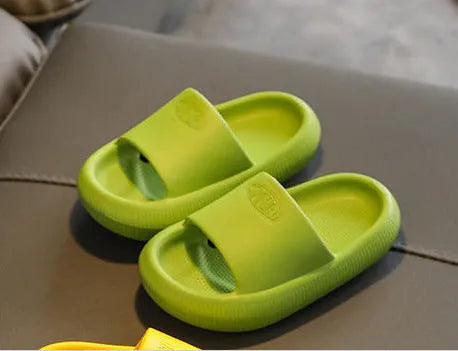 Mixed colour children's EVA slippers with non-slip soles in sizes for ages 24-35.