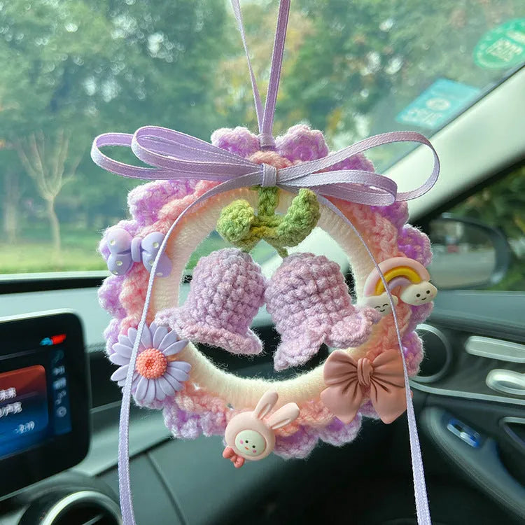 Woven wool bell orchid car pendant in green, pink, purple, and yellow colour options with dream catcher variations