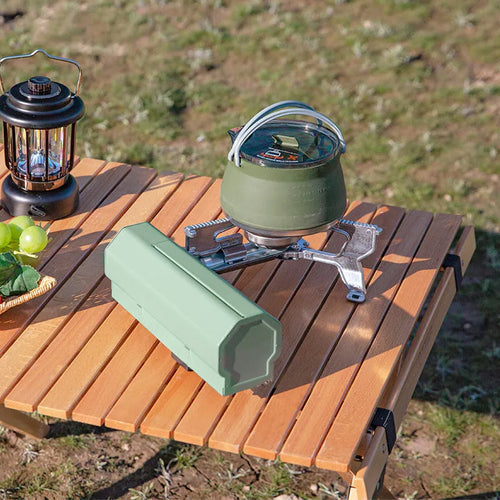 Green folding camping gas stove with adjustable valve and anti-slip feet for outdoor cooking