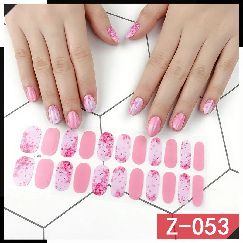 Korean nail sticker sheets showing cartoon designs including strawberries, flowers, bows and chains with nail file