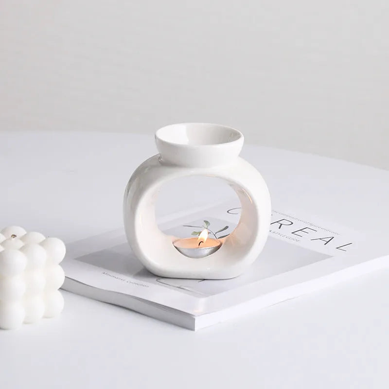 White ceramic Nordic style aromatherapy stove ornament with retro domestic design on tabletop