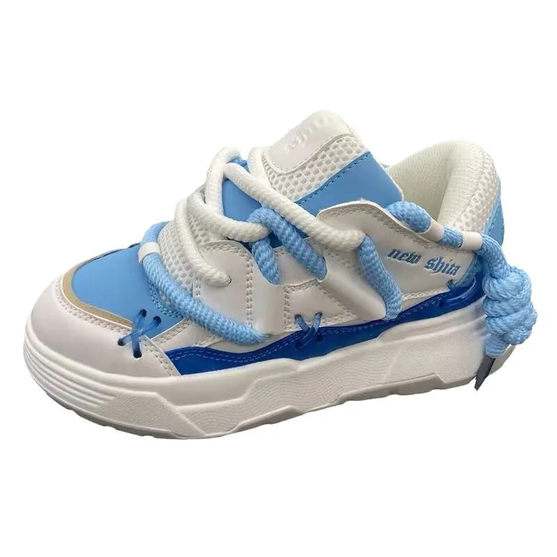 Grey retro clunky sneakers with thick rubber sole and lace-up front, shown on a white background.