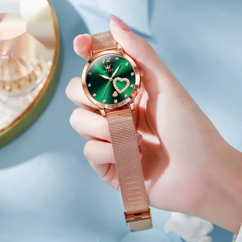 Women's rose gold fashion watch with mesh strap showing six dial colour options
