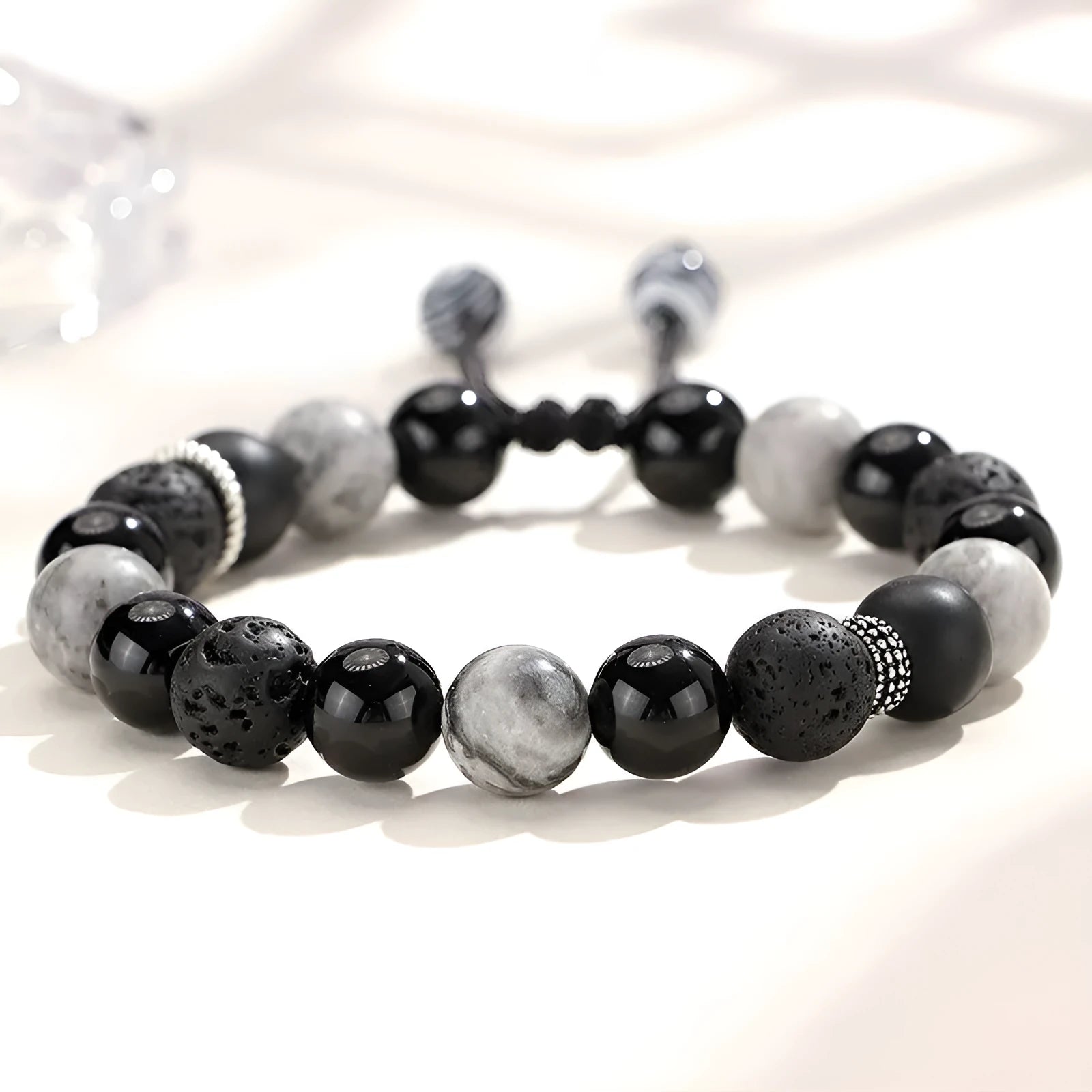 Black agate map stone volcanic bracelet with diamond-shaped stones and electroplated metal components