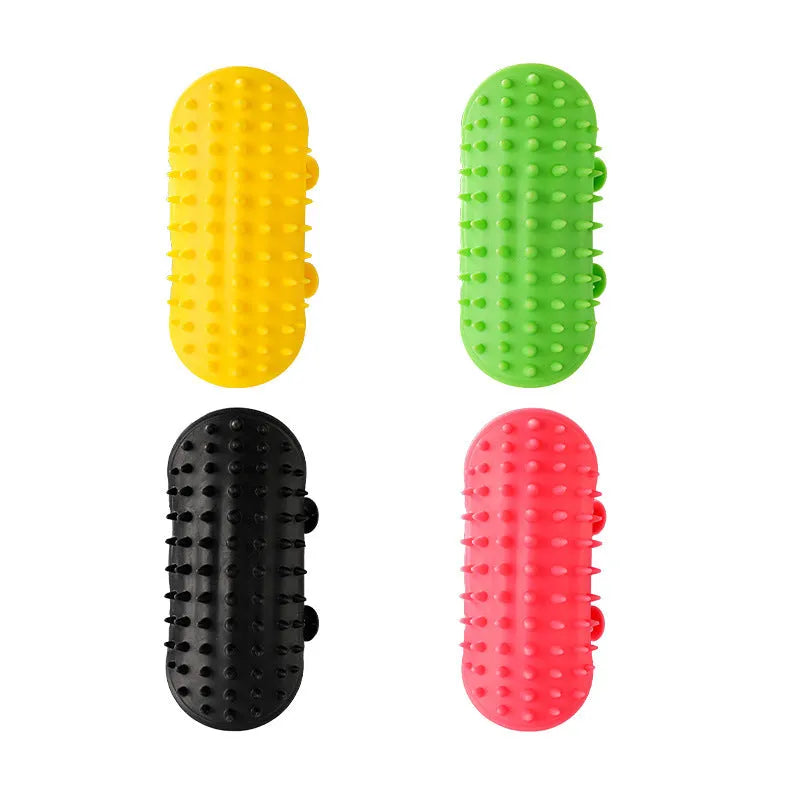 Silicone cat hair removal massage comb attached to a wall corner with rounded teeth for grooming