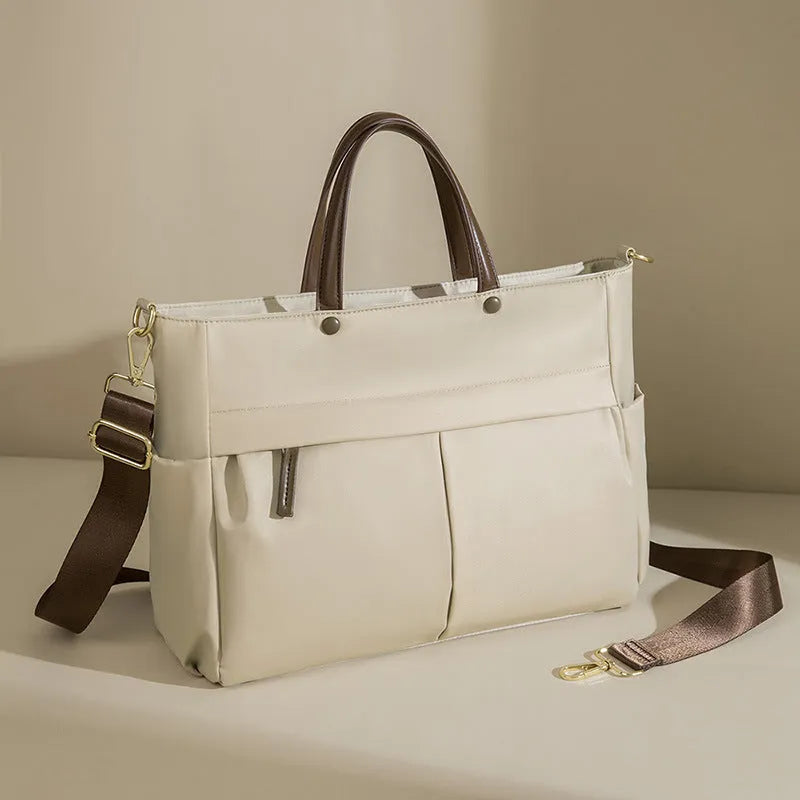 Women's Oxford cloth laptop bag with open pockets showing elegant black and nuts apricots colour options