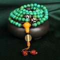 Natural turquoise gemstone bracelet with 108 round 8mm polished beads on a string.