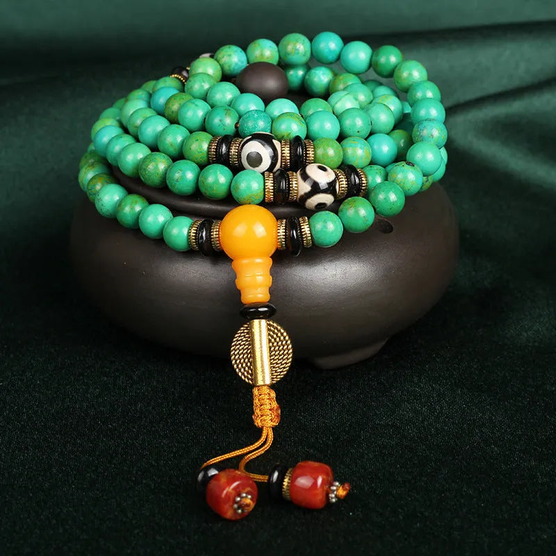 Natural turquoise gemstone bracelet with 108 round 8mm polished beads on a string.