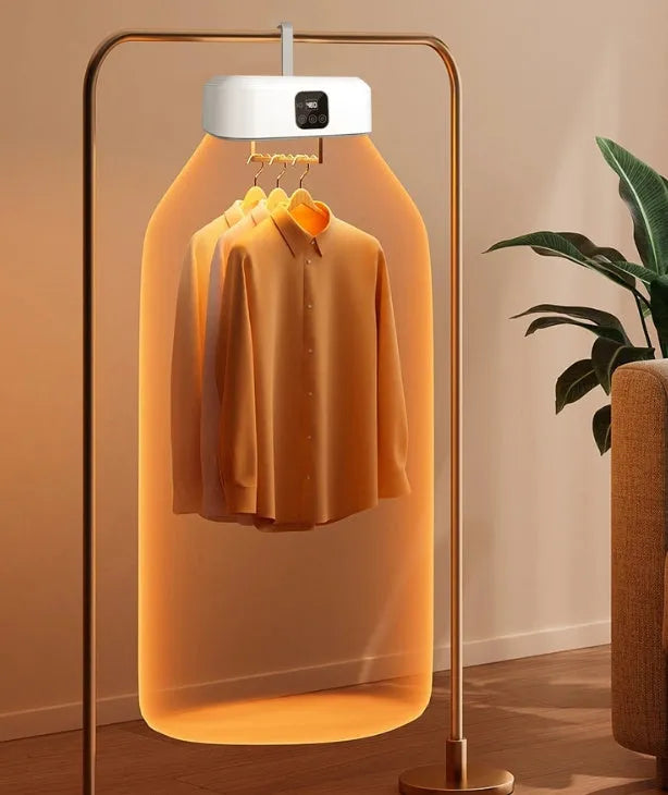 White cylindrical compact clothes dryer with remote control folded for storage