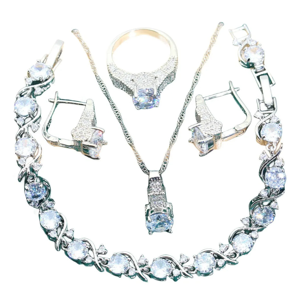 Four-piece bridal jewellery set showing zircon necklace, bracelet, earrings and ring with water wave chain design