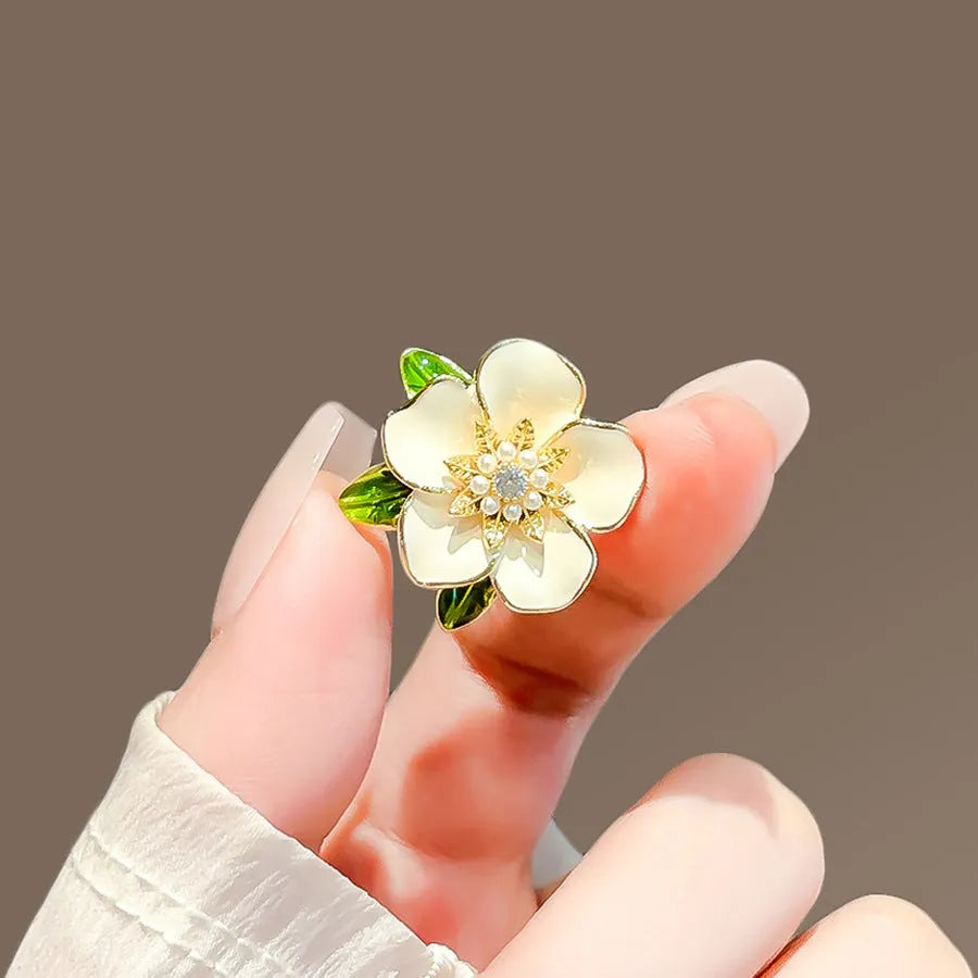 Alloy brooch in natural flower shape with electroplated finish, featuring adjustable and anti-exposure pin closure for women's coats and suits.
