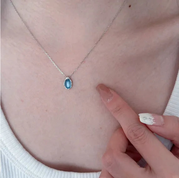 Navy blue geometric water drop pendant necklace with platinum-plated finish on adjustable chain