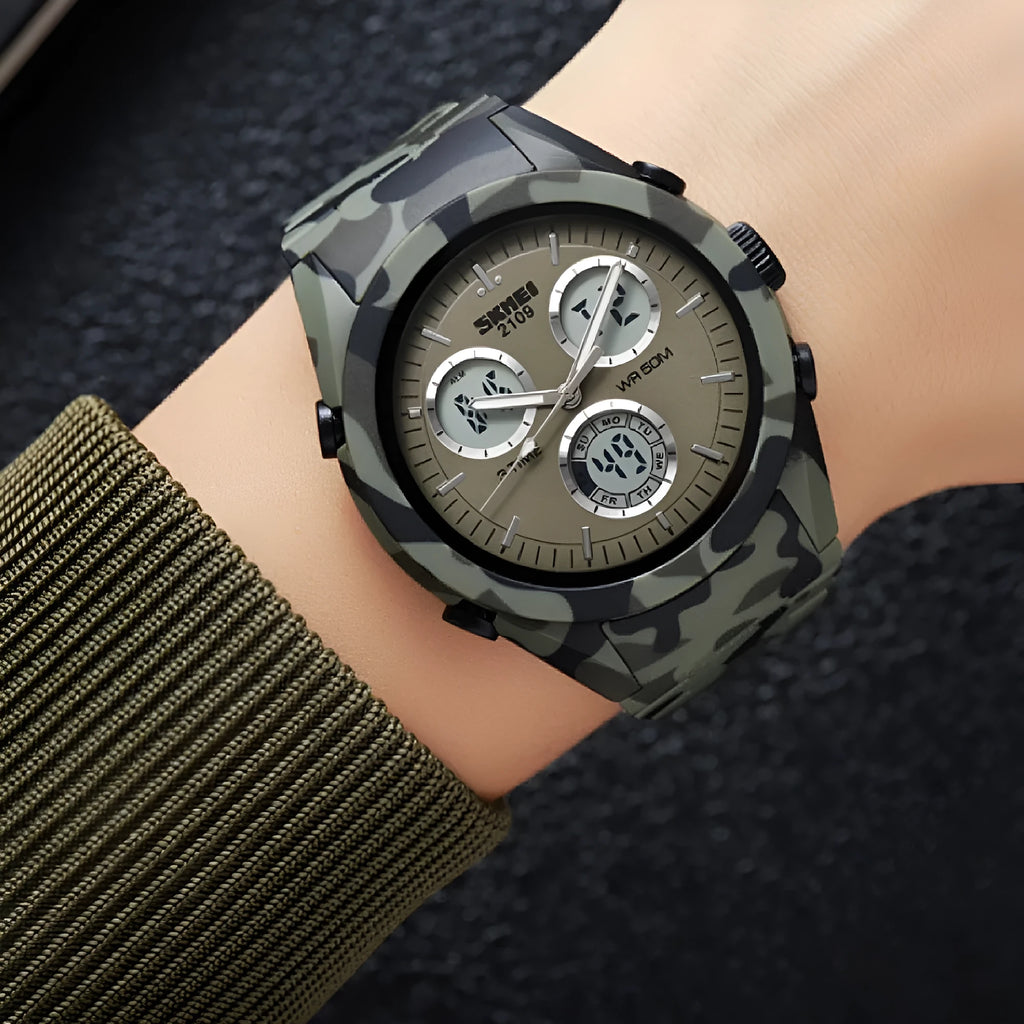 Casual electronic watch with a digital display on a camouflage-pattern TPU strap, showing stainless steel buttons.