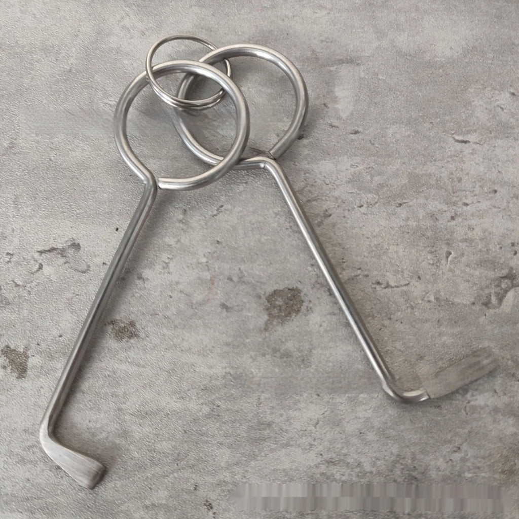 Two identical silver alloy steel wrench tools from a portable household repair set.