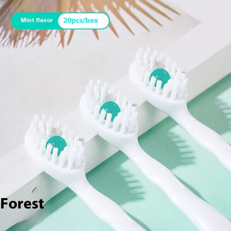 Box of disposable bead toothbrushes in flavours of mint, peach, and plum green tea for travel.